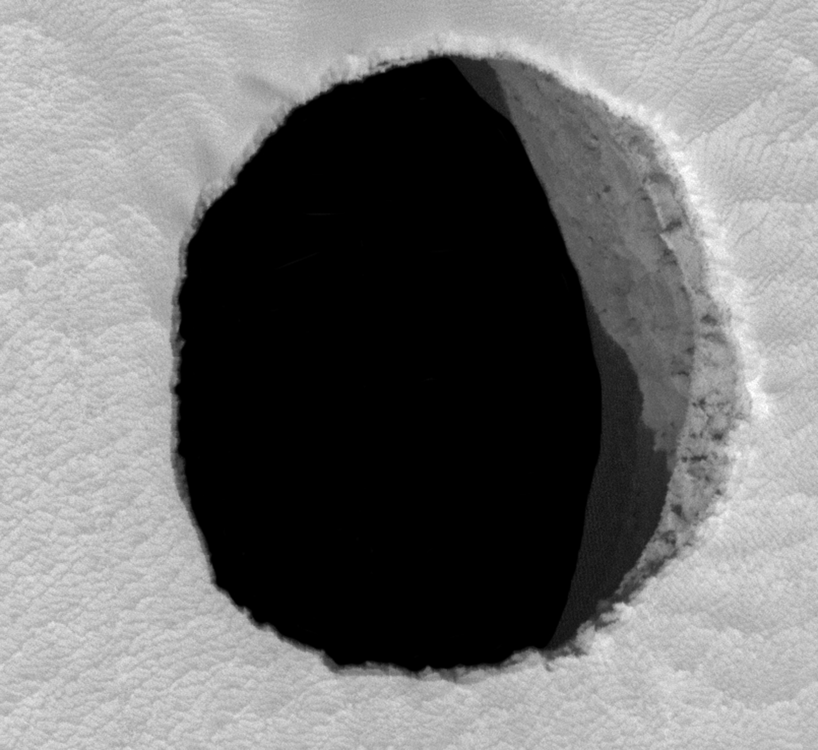 Mars;_Arsia_Mons_cave_entrance_-MRO (1)